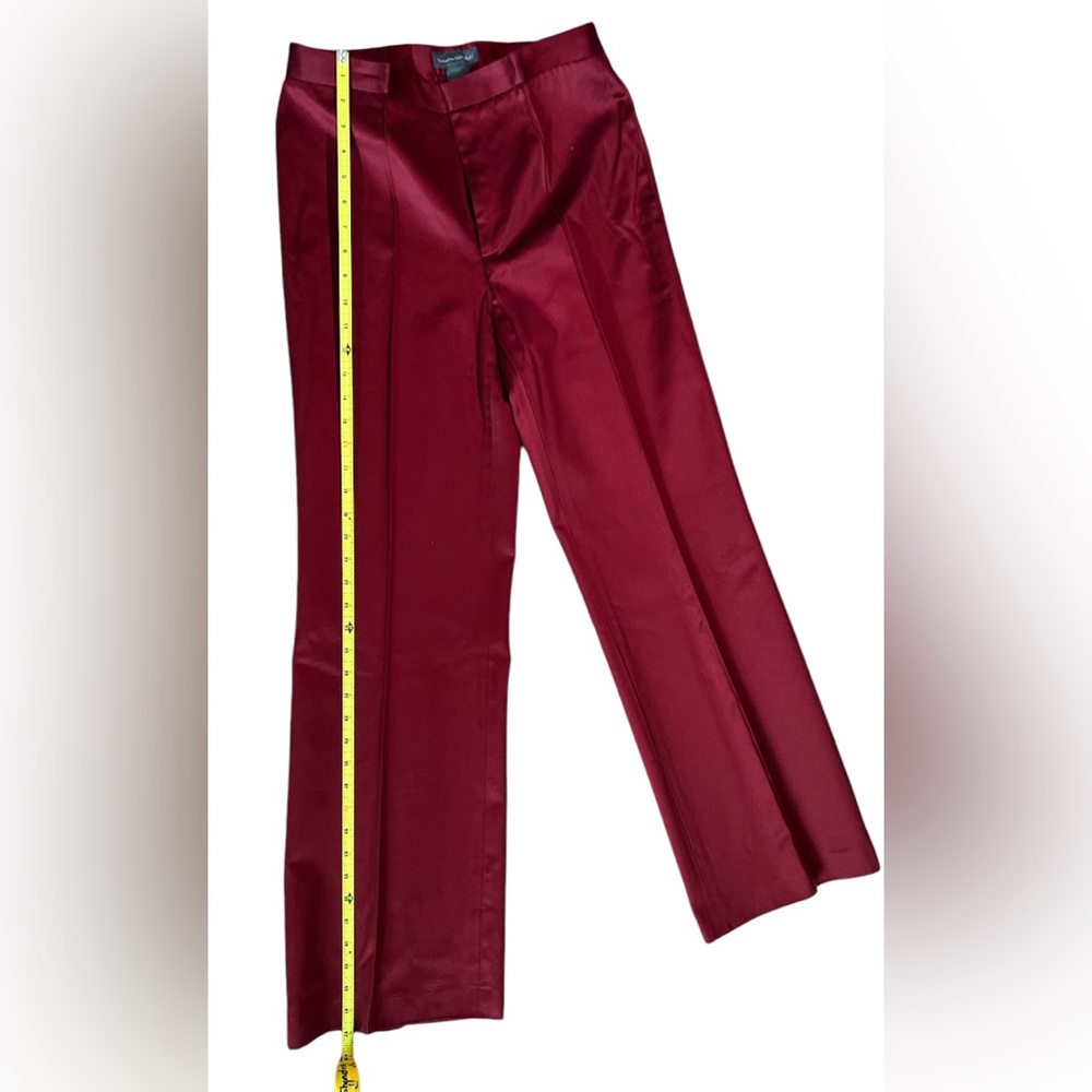 Exquisite burgundy trousers with piping down the front of pant legs.